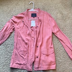 Brand new, never worn, tags still on! Has 2 pockets and buttons.
